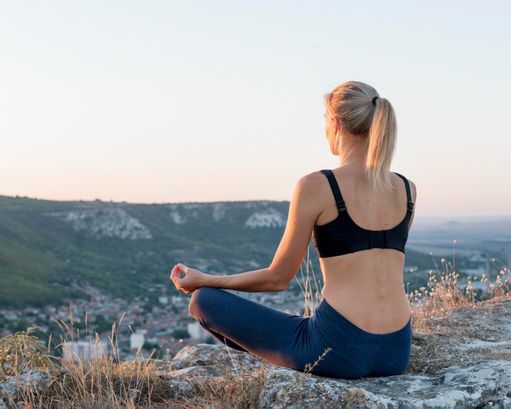 beautiful blonde woman practicing yoga outdoors 1 1