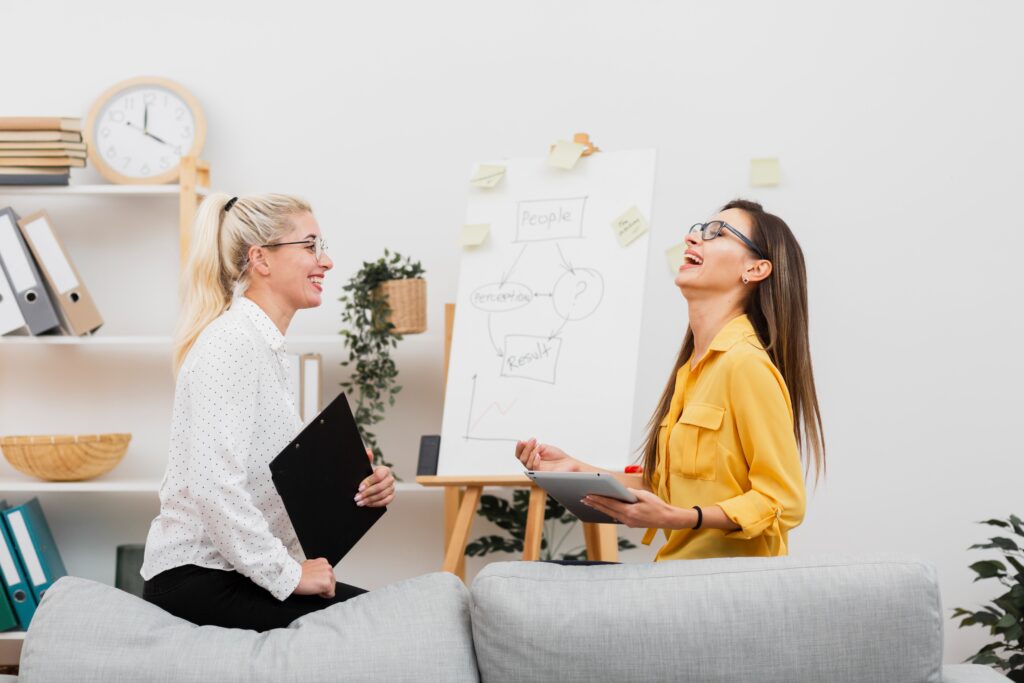 lateral view smiling women holding tablet clipboard 1