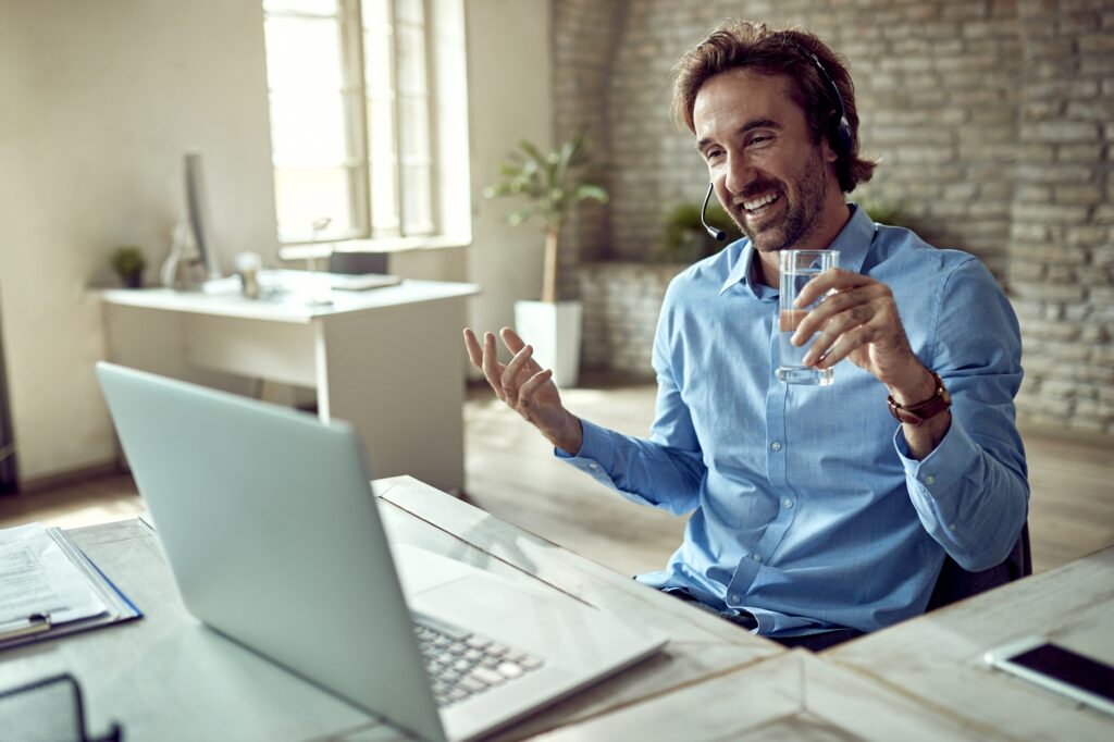 young happy businessman having video call computer while working office 1 1