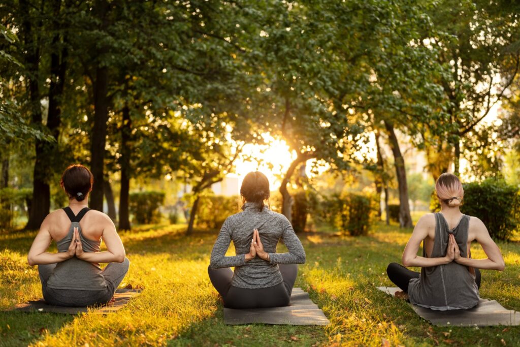 back view women meditating outdoors 1 1 1